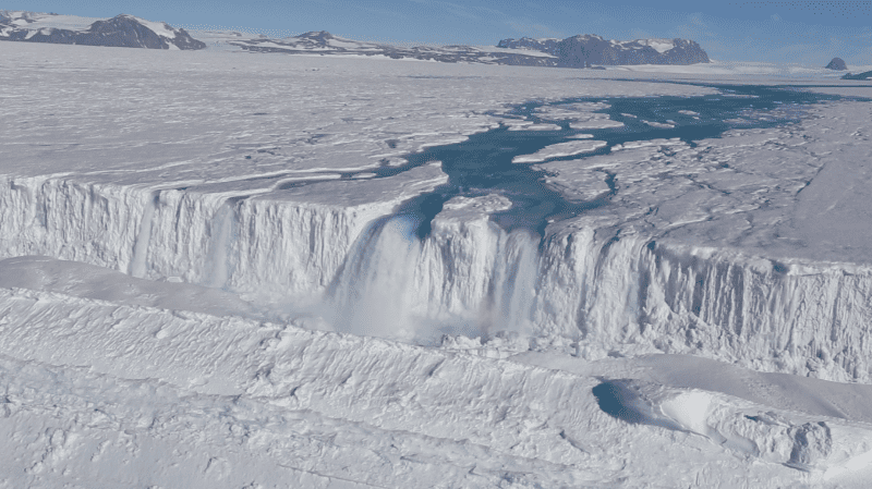 An enormous waterfall gushes off the Nansen Ice Shelf . Credit: Jonathan Kingslake
