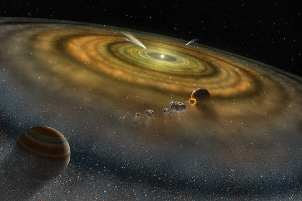 Artist's conception of the dust and gas surrounding a newly formed planetary system. Credit: NASA.