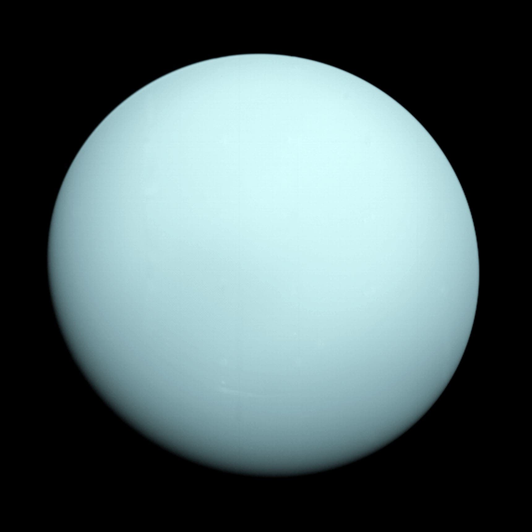Uranus as a featureless disc, photographed by Voyager 2 in 1986.