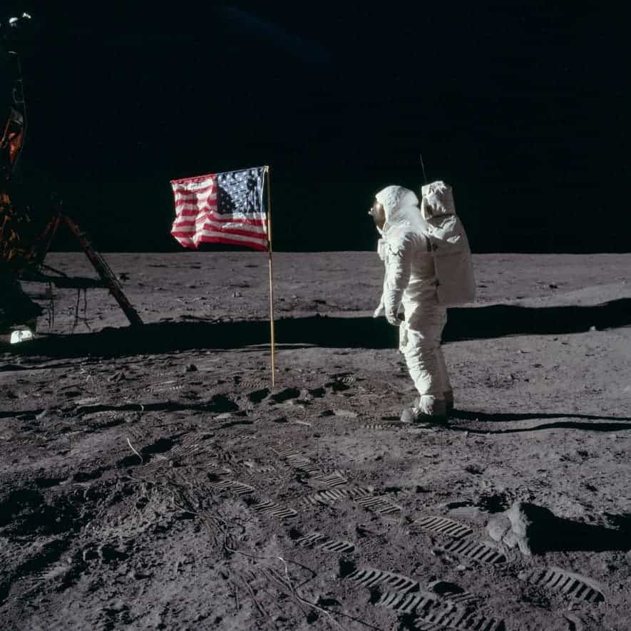 Apollo 11 astronaut Edwin “Buzz” Aldrin poses with the US flag planted on the Sea of Tranquility. If you look closely, you can see Aldrin’s face through his helmet visor.