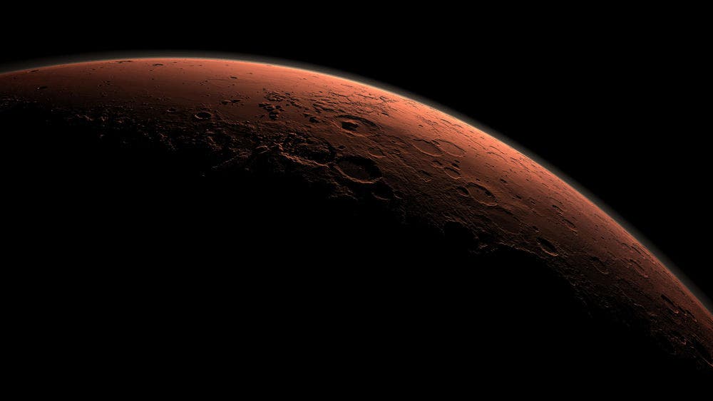 This computer-generated view depicts part of Mars at the boundary between darkness and daylight. Credit: NASA/JPL-Caltech/Handout