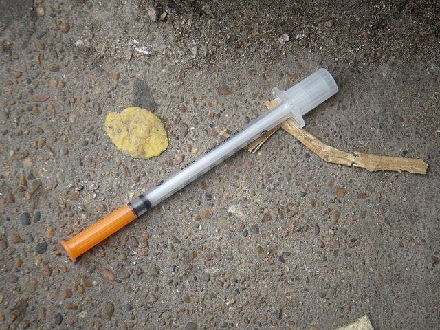 Heroin needle found in the gutter. Credit: Wikimedia Commons.