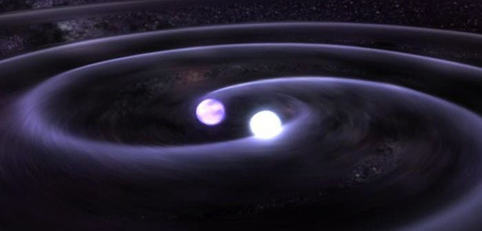 Artistic depiction of spinning / colliding neutron stars. Credits: Los Alamos National Laboratory.