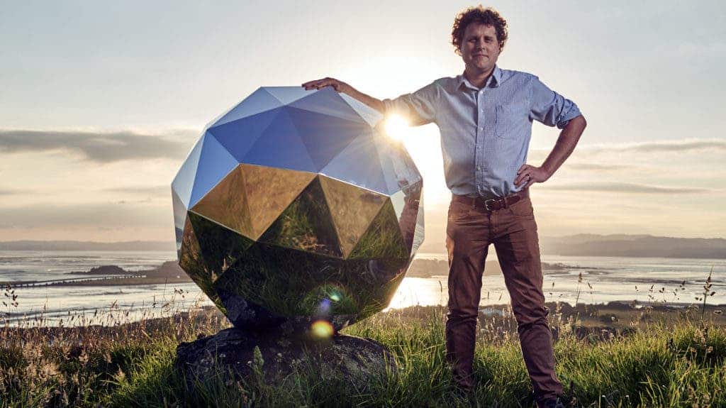 Rocket Lab founder and CEO Peter Beck next to the mirror-covered sphere his company sent into Earth's orbit. Credit: Rocket Lab.