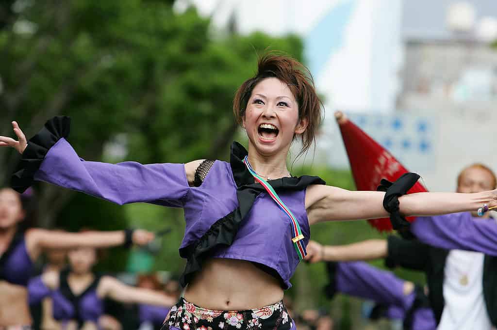 Happy Japanese woman with exposed belly button