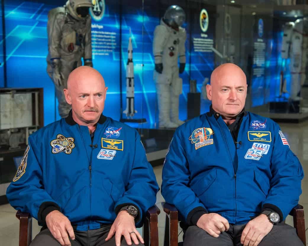 Mark Kelly (left) and Scott Kelly (right) speak to news media on Jan. 19, 2015 about Scott Kelly's 1-year mission aboard the International Space Station. Image credits: Robert Markowitz / NASA.