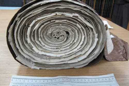The rolled-up parchment that holds news of the reward William Weston received from King Henry VII. Image credits: The National Archives, UK.