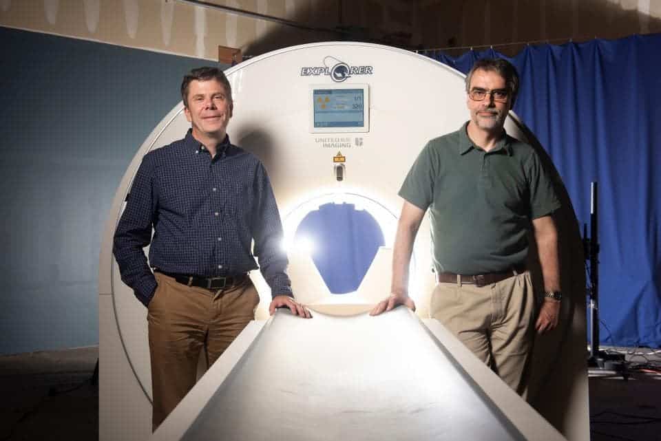 Simon Cherry (left) and Ramsey Badawi with a mockup of the EXPLORER total-body scanner. Credit: Lisa Howard/UC Davis.