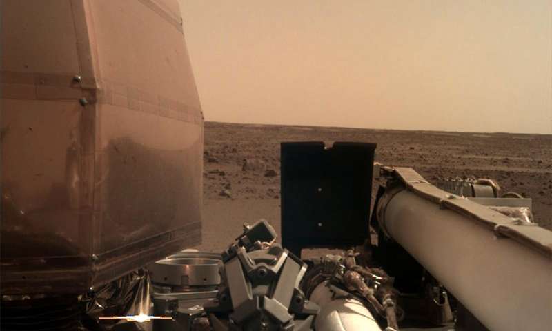The picture was taken on November 26, 2018, the same day InSight landed on the Red Planet. The probe's camera was still covered by a transpared dust cover which is meant to prevent damage to the lens upon landing. Credit: NASA/JPL-Caltech.