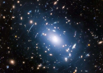 Abell S1063, a galaxy cluster, was observed by the NASA/ESA Hubble Space Telescope as part of the Frontier Fields programme. The huge mass of the cluster — containing both baryonic matter and dark matter — acts as cosmic magnification glass and deforms objects behind it. In the past astronomers used this gravitational lensing effect to calculate the distribution of dark matter in galaxy clusters. Credit: NASA, ESA, and M. Montes (University of New South Wales, Sydney, Australia).