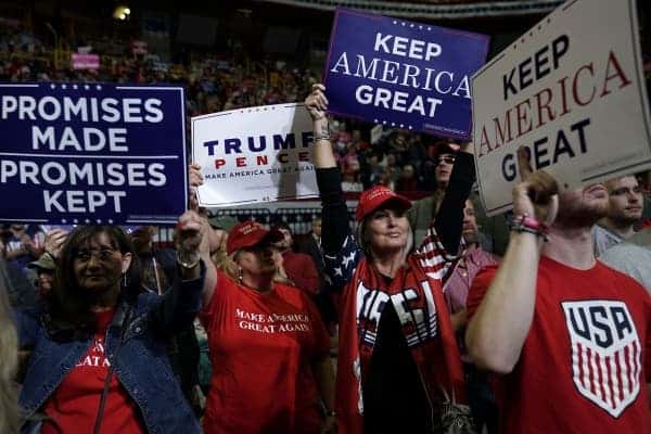 Supporters of U.S. President Donald Trump hold up signs during a campaign rally for Rep. Marsha Blackburn (R-TN) and other Tennessee Republican candidates at the McKenzie Arena November 4, 2018 in Chattanooga, Tennessee. Image credits: Institute for global change.