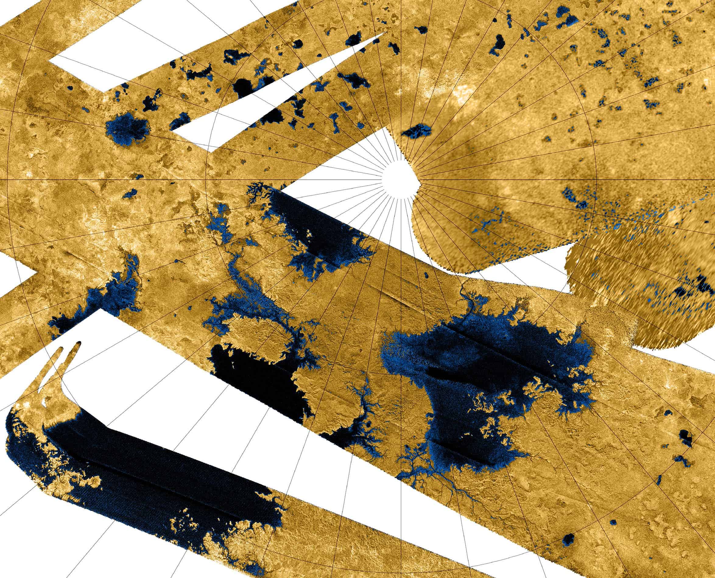 A false-color radar mosaic of Titan's north polar region. Blue coloring depicts hydrocarbon seas, lakes and tributary networks filled with liquid ethane, methane and dissolved Nitrogen. Image credits: NASA / JPL-Caltech / USGS.
