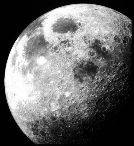 After Apollo 12 left lunar orbit this image of the Moon was taken from the command module. Image via NASA.