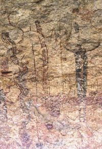 Pecos River style pictographs in Rattlesnake Canyon. You can see a rattlesnake depiction on the left of a dark shaman figure. Credit: Steve Black.