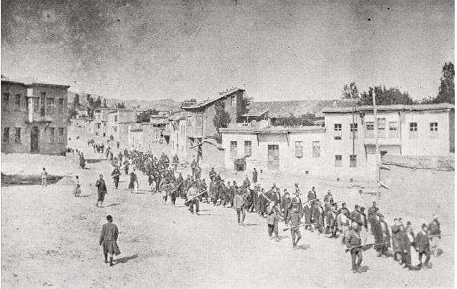 Armenian civilians, escorted by Ottoman soldiers, marched to a prison in 1915.
