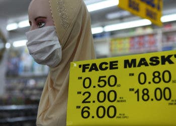 medical face mask displayed on a mannequin inside a discount super market in the center of Georgetown/Penang on Penang island, Malaysia