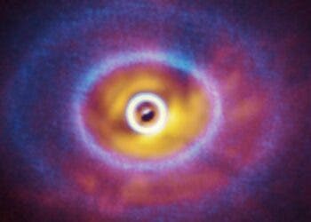 GW Orionis, a triple star system with a peculiar inner region. Unlike the flat planet-forming discs we see around many stars, GW Orionis features a warped disc, deformed by the movements of the three stars at its centre. This composite image shows both the ALMA and SPHERE observations of the disc. (ESO/Exeter/Kraus et al., ALMA (ESO/NAOJ/NRAO))