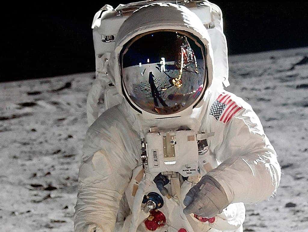 astronaut holding the moon