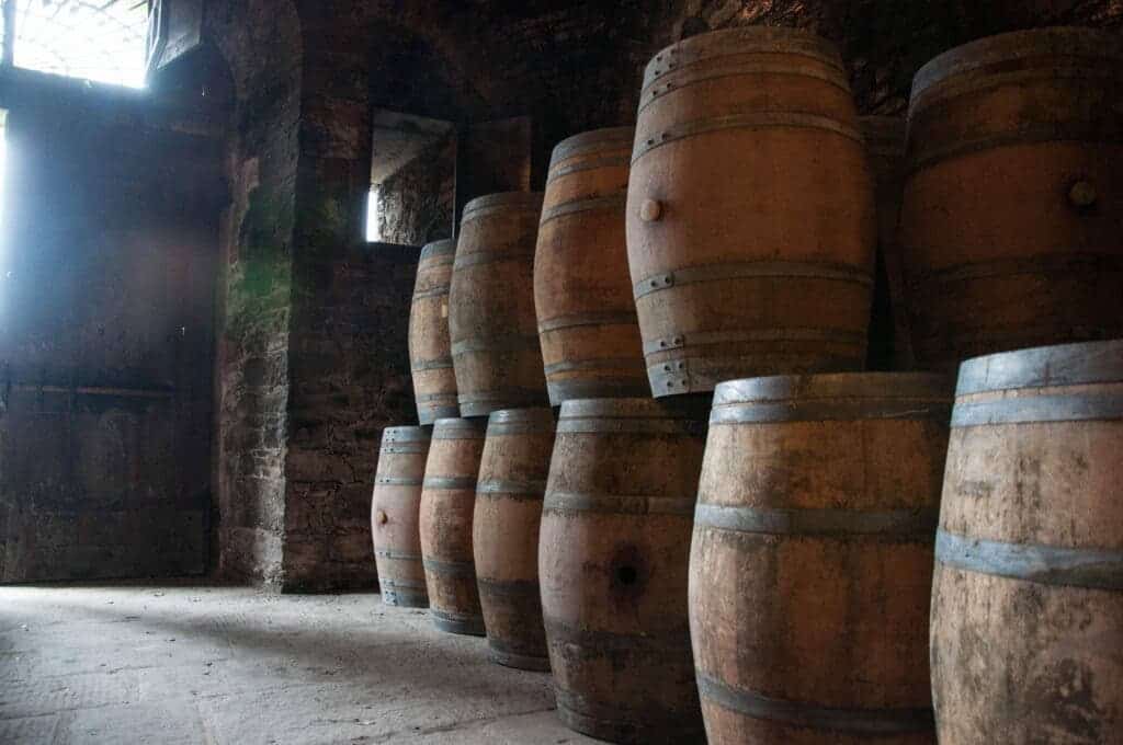 Rum being left to age in wooden barrels.