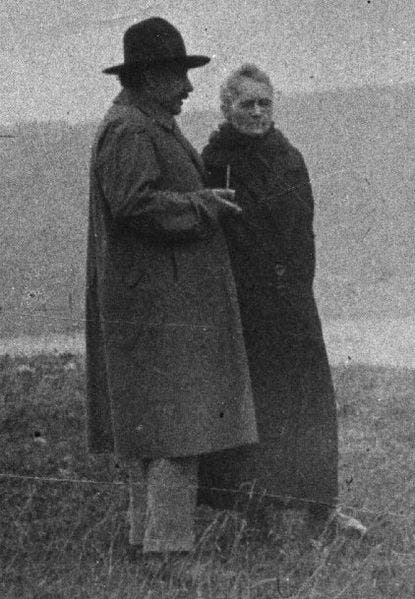 old photo of albert einstein and marie curie together 