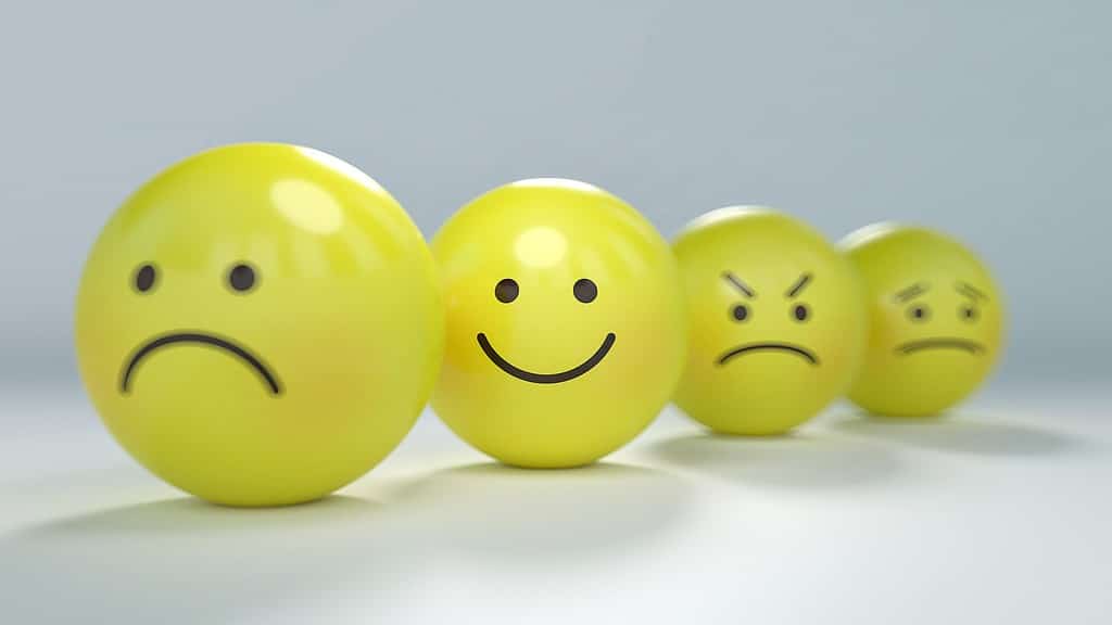 Balls shaped like emoticons showing different emotions. 