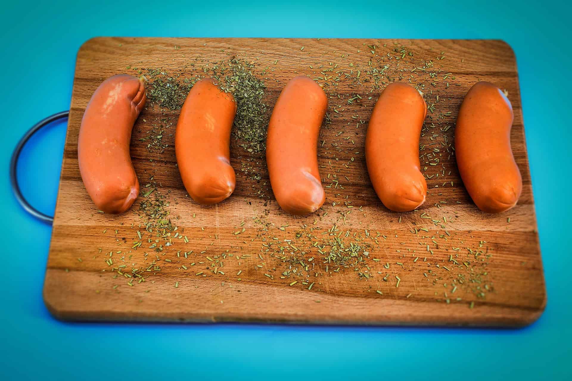 Sausages on a wooden plate