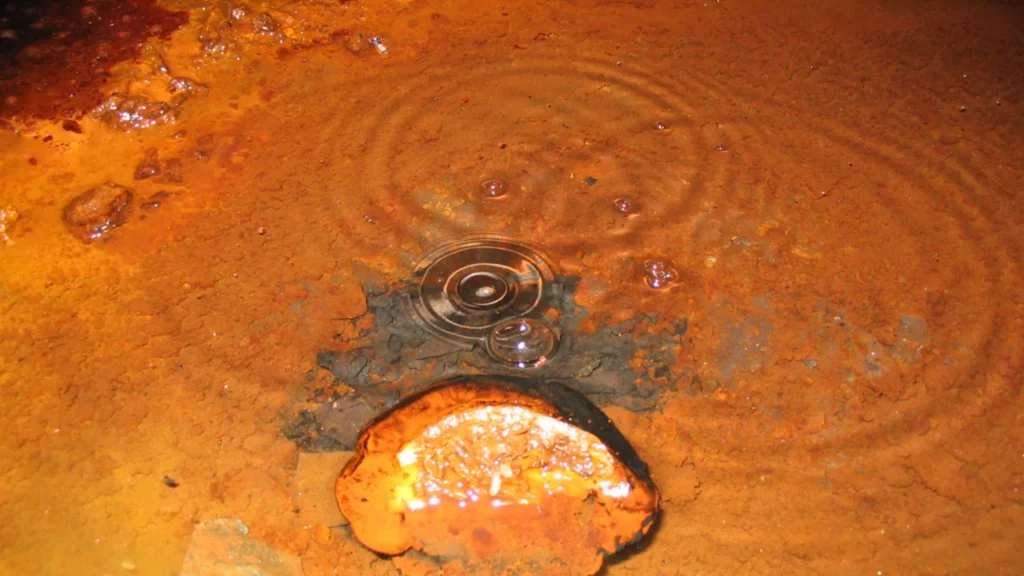 Gas bubbles out of the floor of a deep mine in Canada, containing ingredients that could sustain life. Credit: J. Telling. 