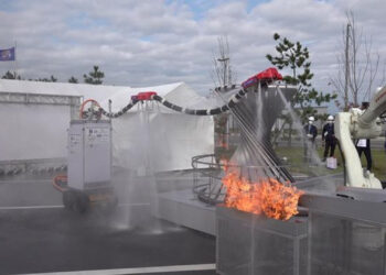 Dragon Firefighter robot spewing water on flames.