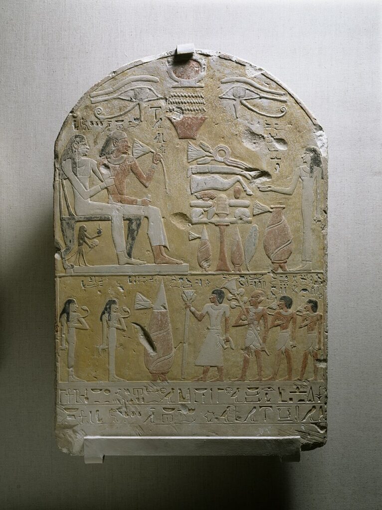 The funerary stele of Tembu depicting the lotus several times, most of which are wrapped around wine jars